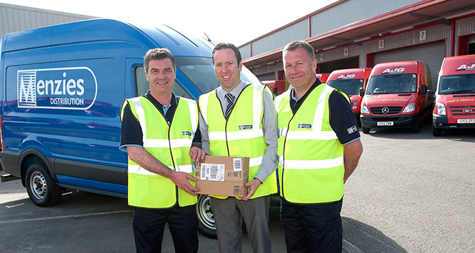 Menzies Distribution and AJG Parcels staff holding a package