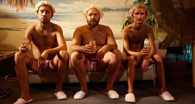 Men in tanning salon drinking Southern Comfort