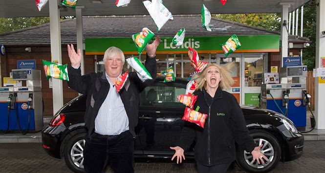 Lennart Palleson celebrates with Londis worker