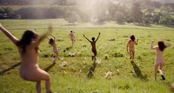 Naked people running through field