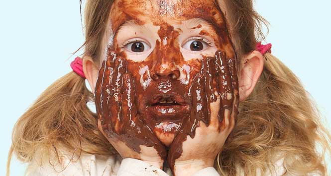 girl covered in chocolate sauce
