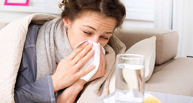 Woman sneezing