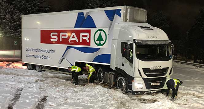 Spar lorry getting dug out of snow