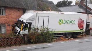 Brakes lorry crashed into side of house