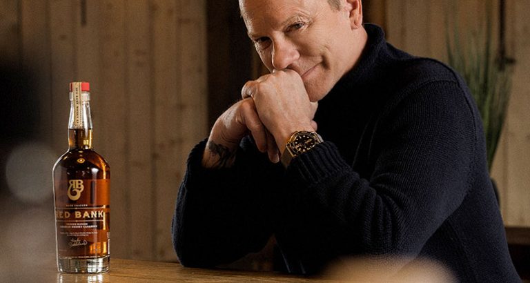 Kiefer Sutherland with bottle of Red Bank whisky